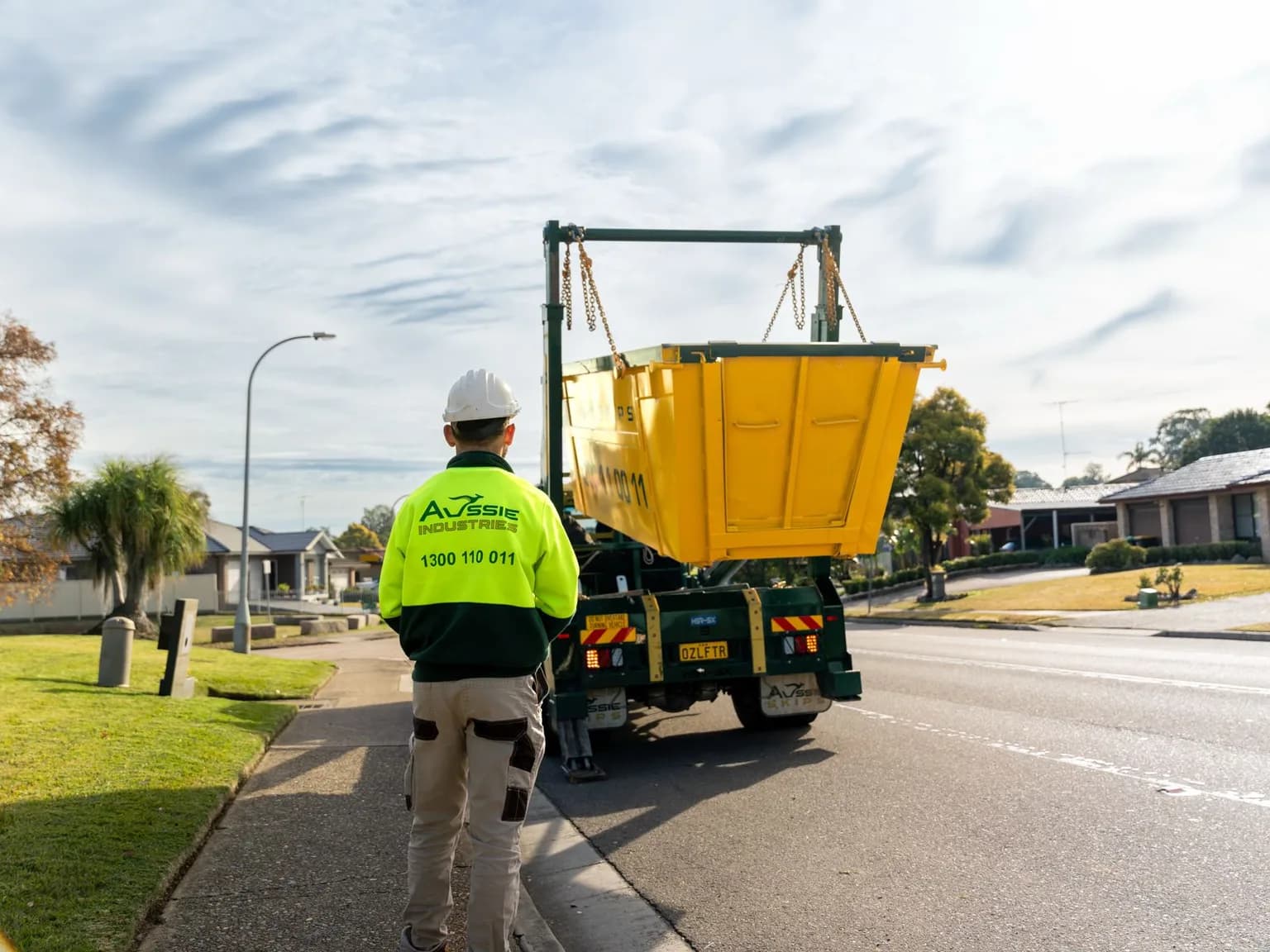 Aussie Skips truck and skip bin outside a Sydney home